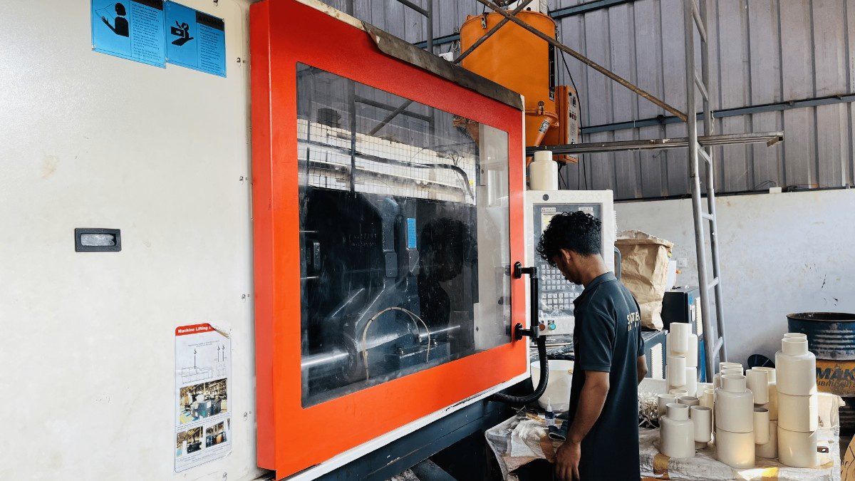 How does the injection molding process work in a job work setup?